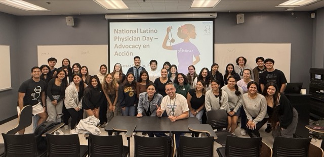 CHE members gathered in a classroom for a health-focused event